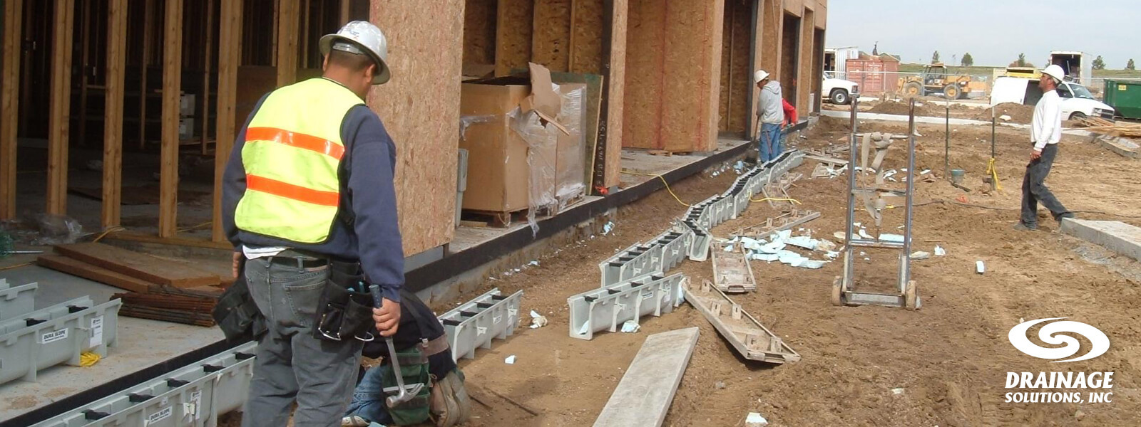 Contractors planning and installing a 2026 drainage project