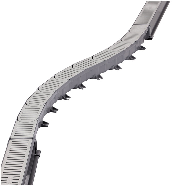 NDS slim channel drain installed in pool deck patio for surface water drainage.